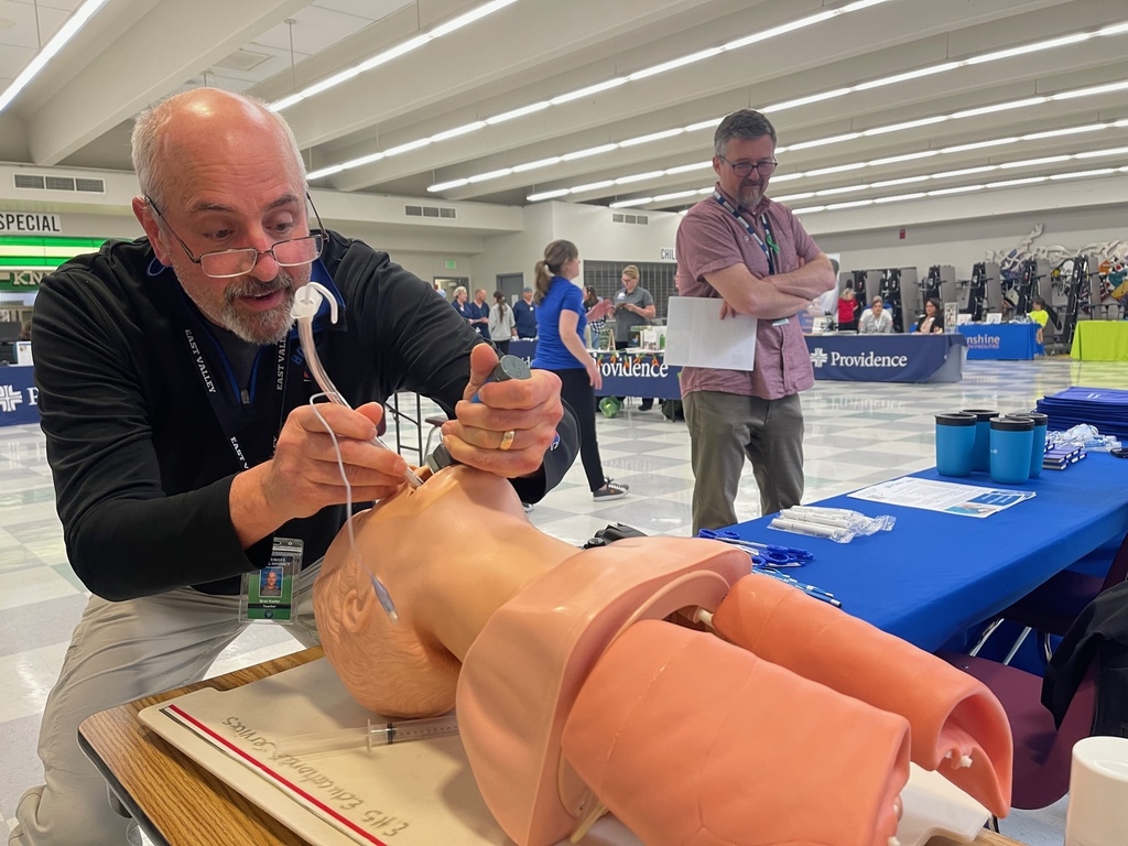 Teacher practicing intubation on a dummy