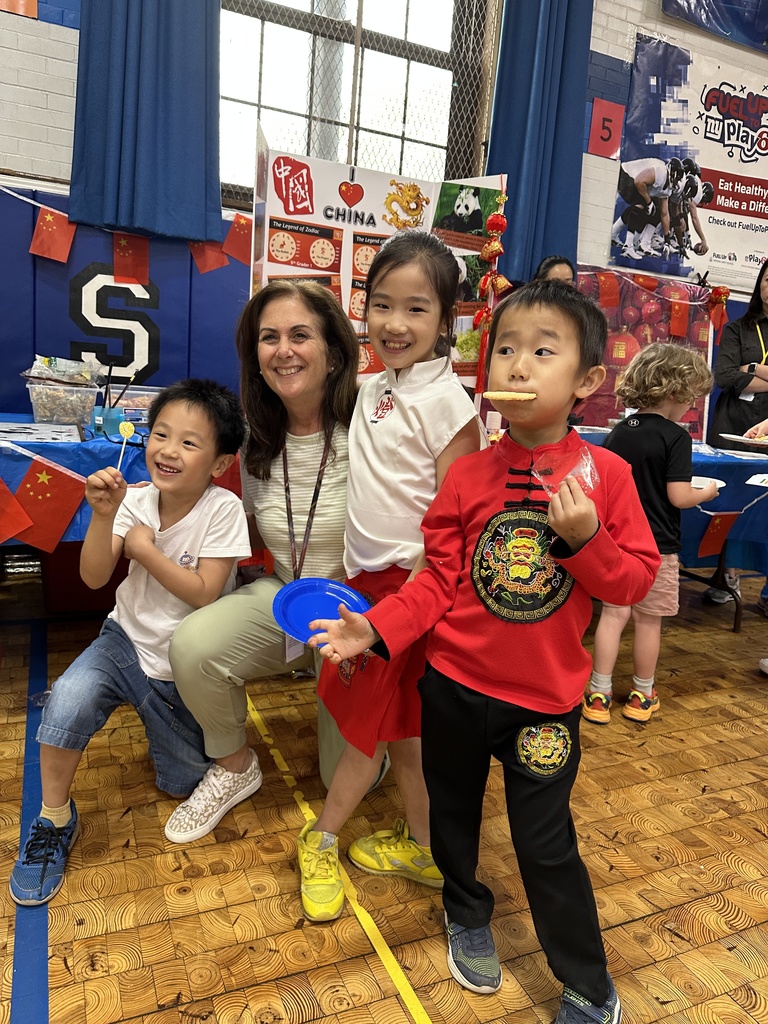 Mrs. Morris with two of her students during the Multicultural Festival