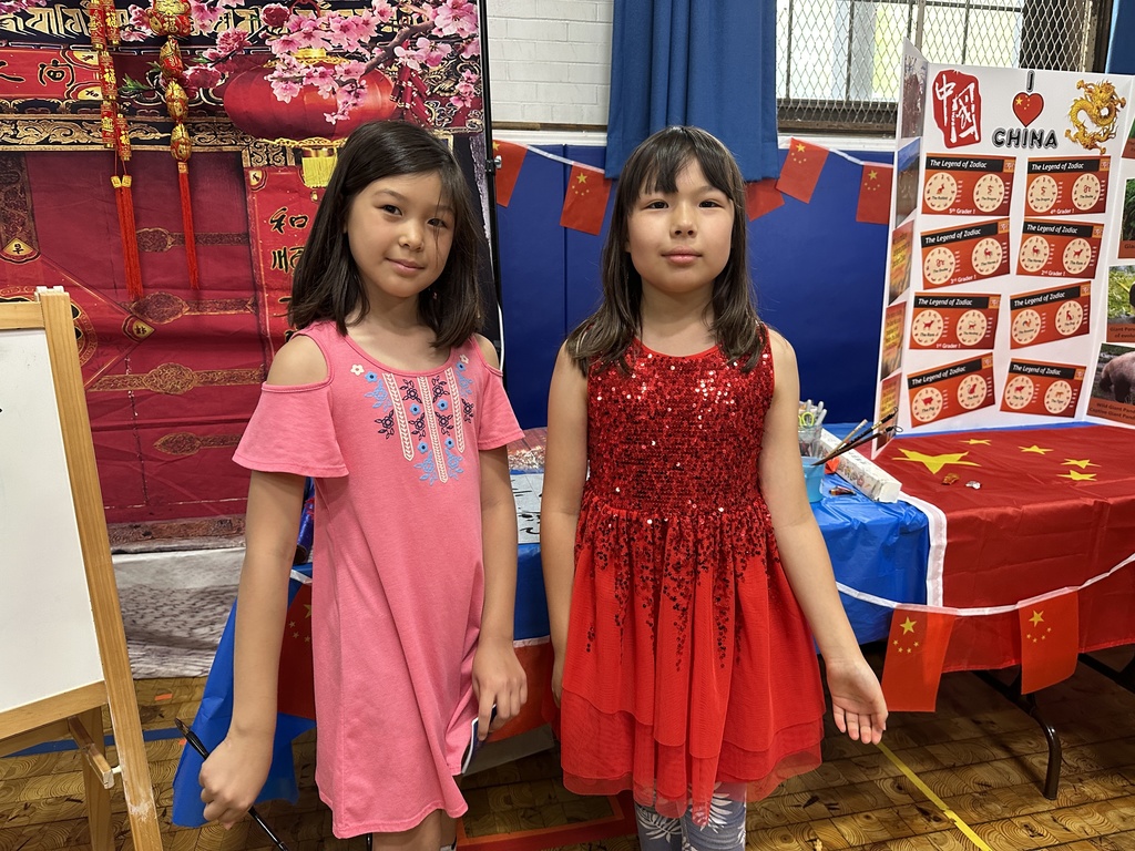 Two girls standing in front of the display for China