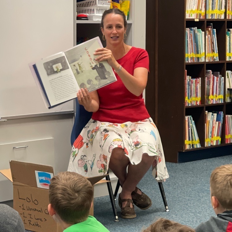 Amanda Curtis reads to fourth grade