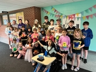 7th graders delivering monster projects to 1st graders