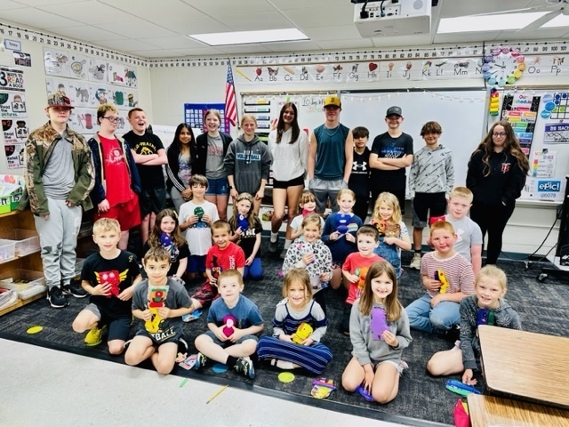 7th graders delivering monster projects to 1st graders