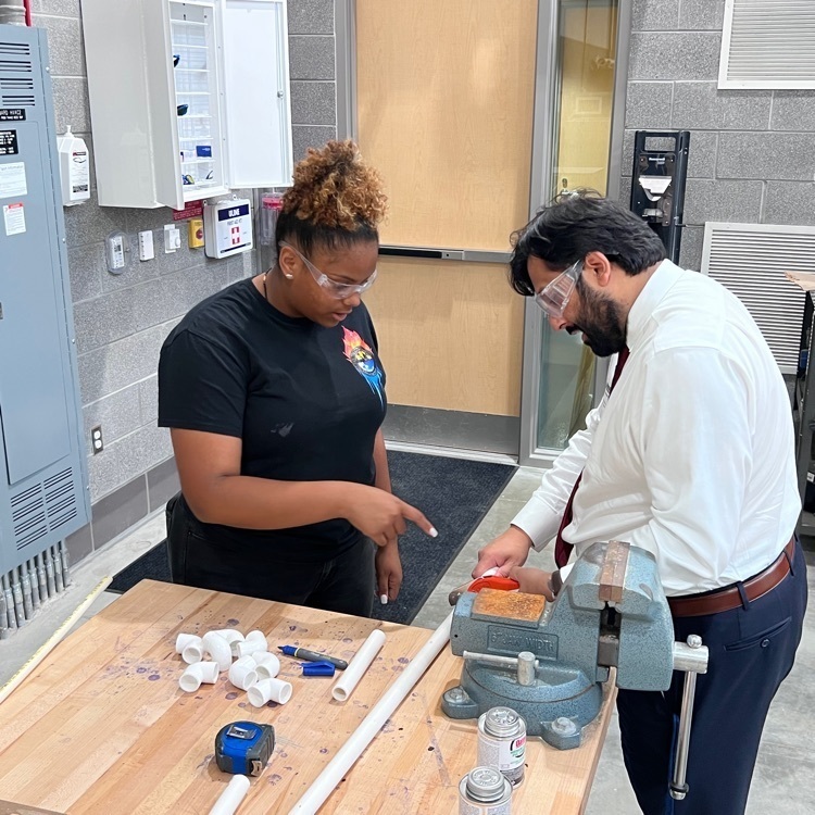 female student and older adults working together