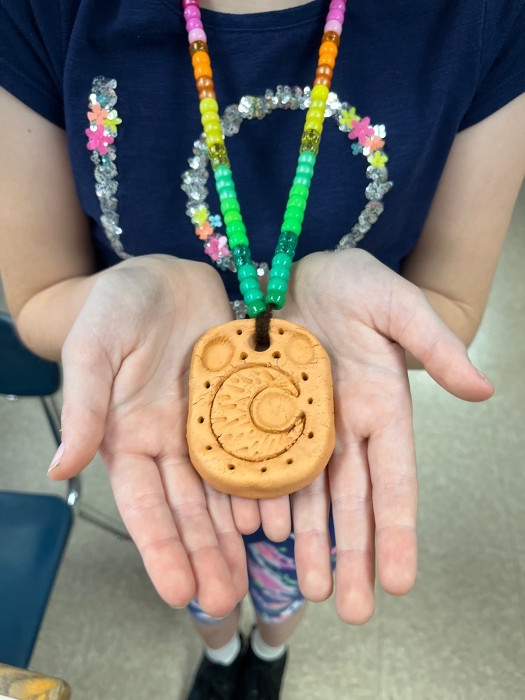 student with pendant