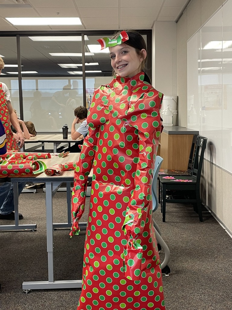 When you find leftover wrapping paper, you find ways to use it up. Our 8th graders got creative