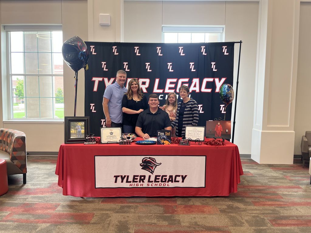 Brenden Mitchell and his family at his signing