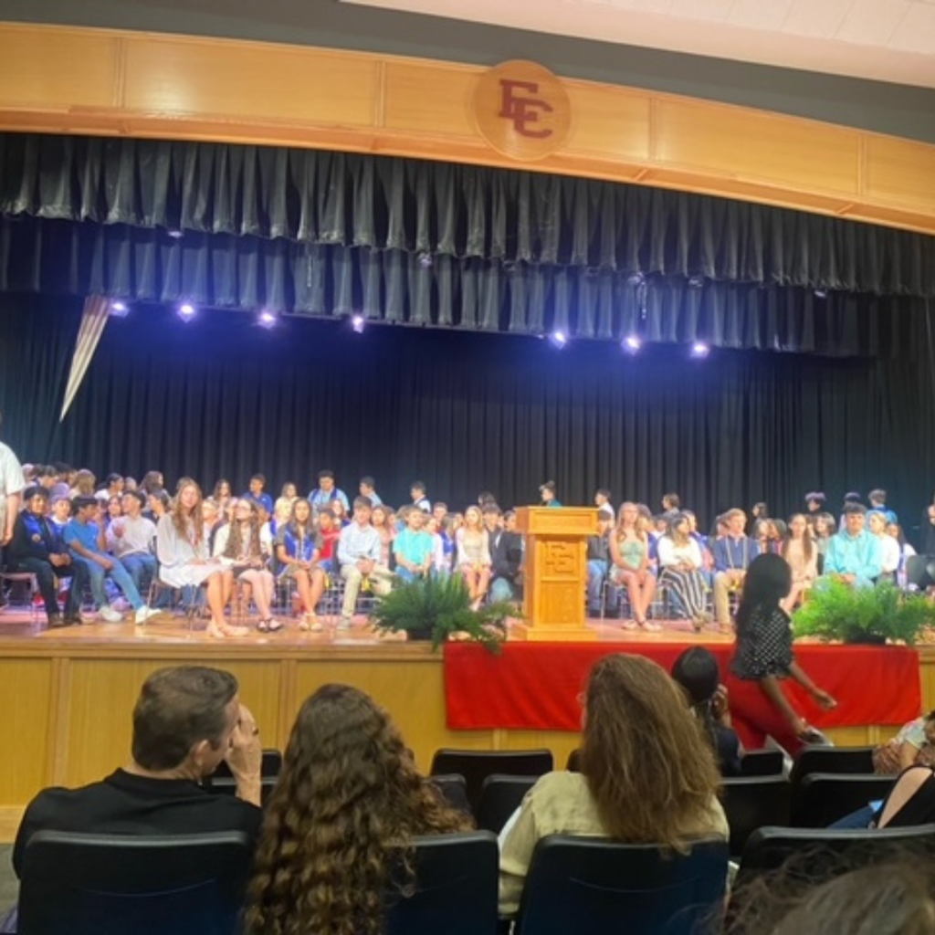 several students on stage at the ceremony