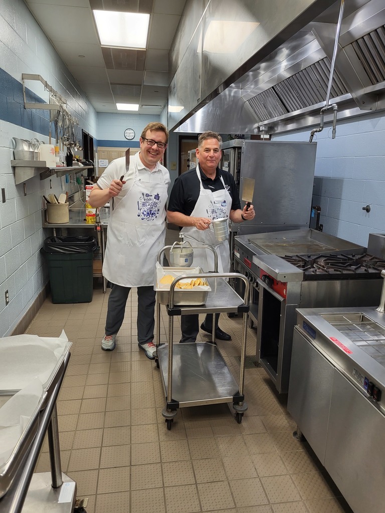 Principals Grodek and McAndrews making pancakes