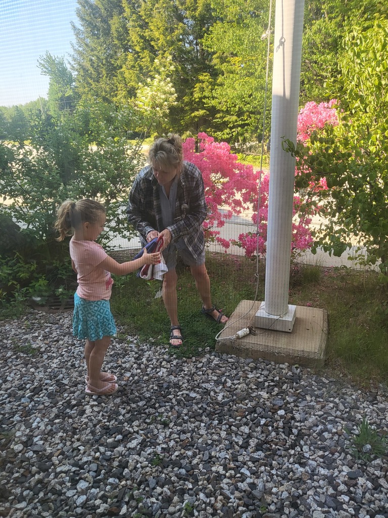 Putting up the flag.