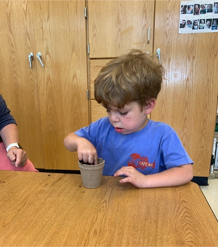 student planting a seed