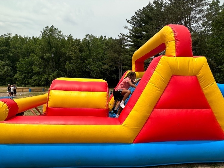 picture of Cooper students in bounce house during field day