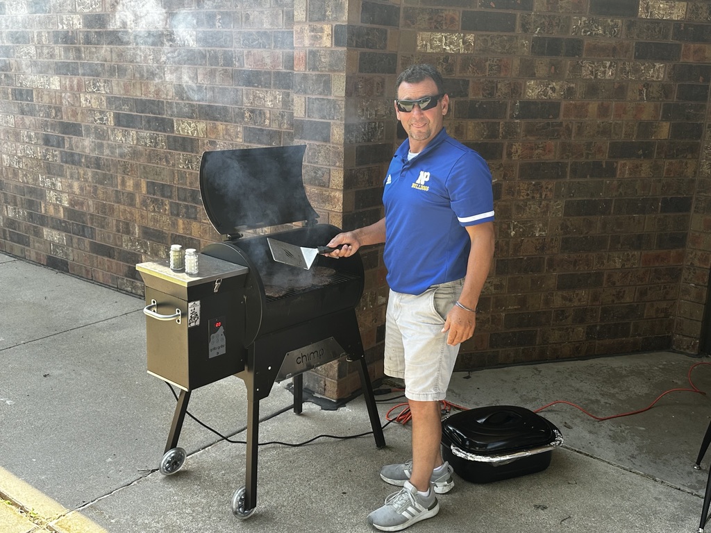 Mr. Joneson Cooking Burgers