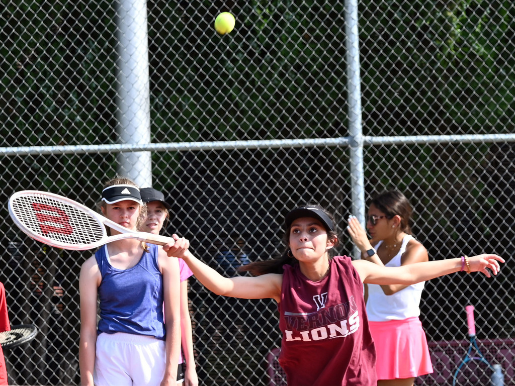 girl reaching for ball