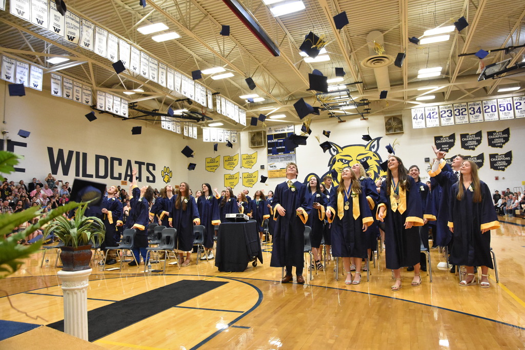 Students throwing caps