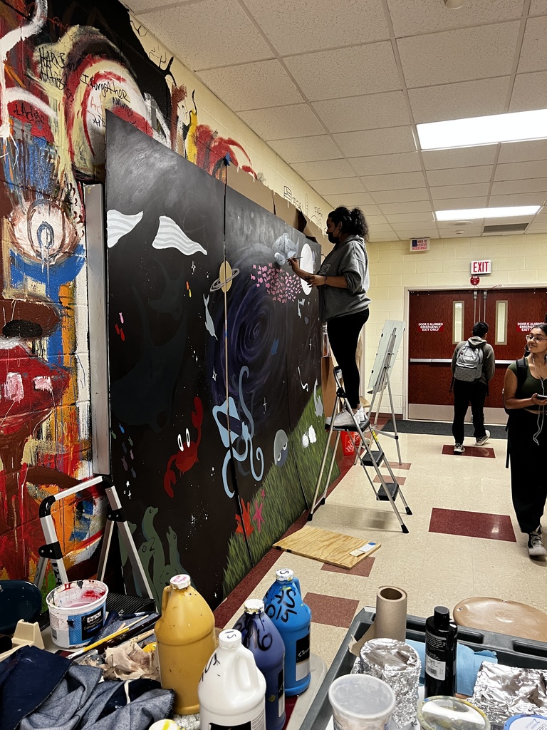 students work on mural