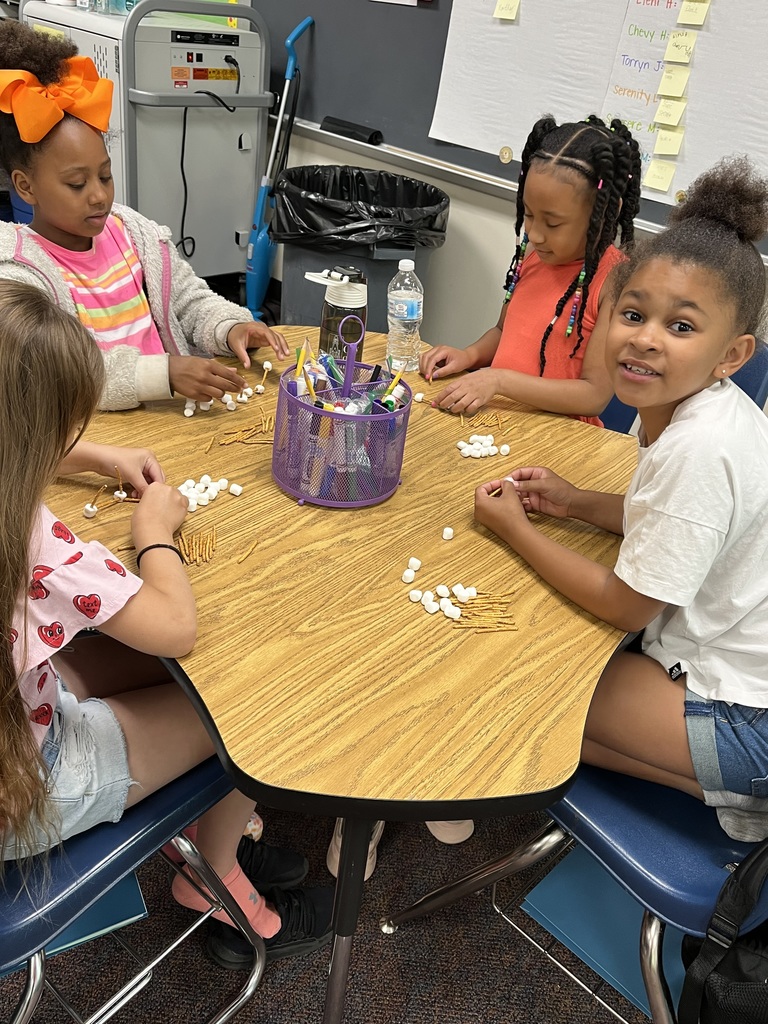 students building structures out of marshmallows and toothpicks