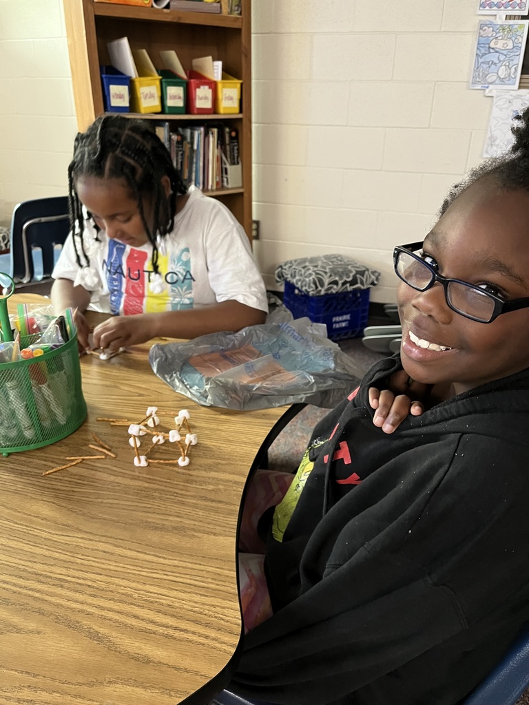 students building structures out of marshmallows and toothpicks