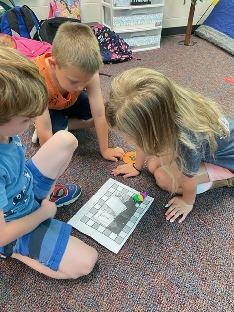 students playing a board game