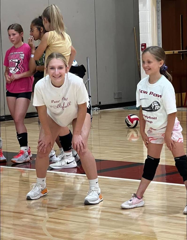 2 volleyball players in gym