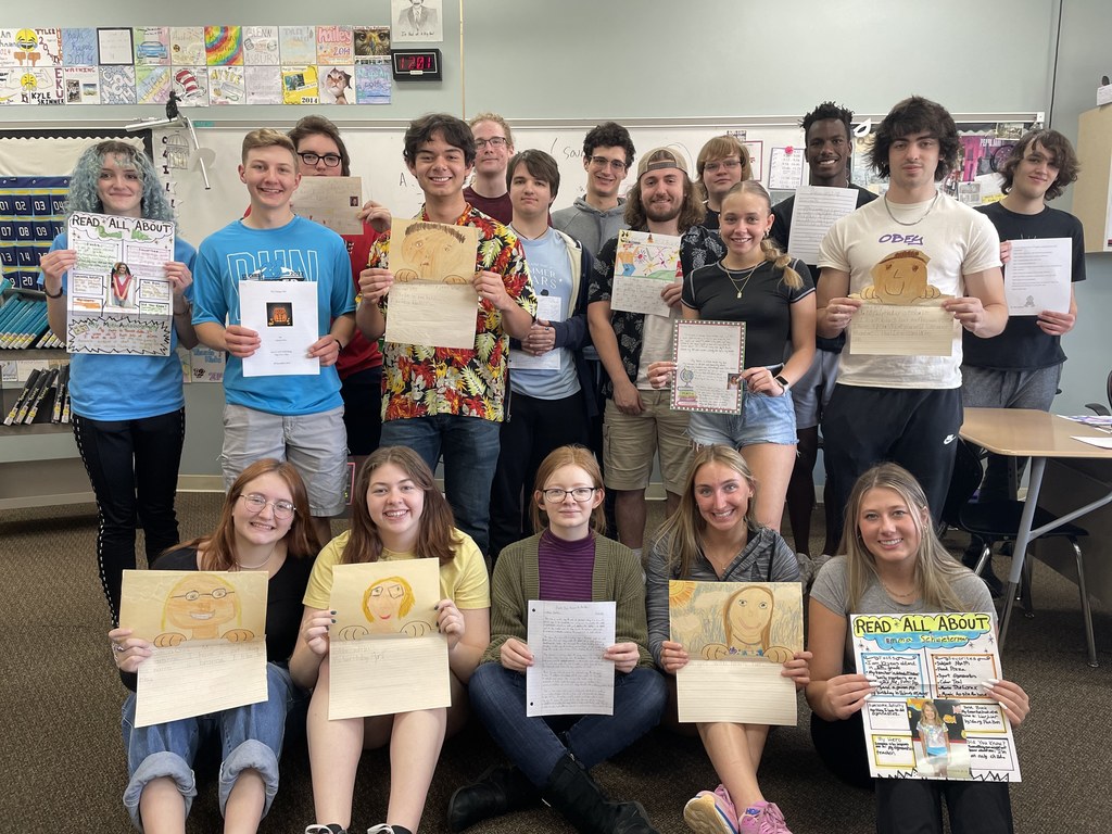 A group of THS students with their elementary writing samples.