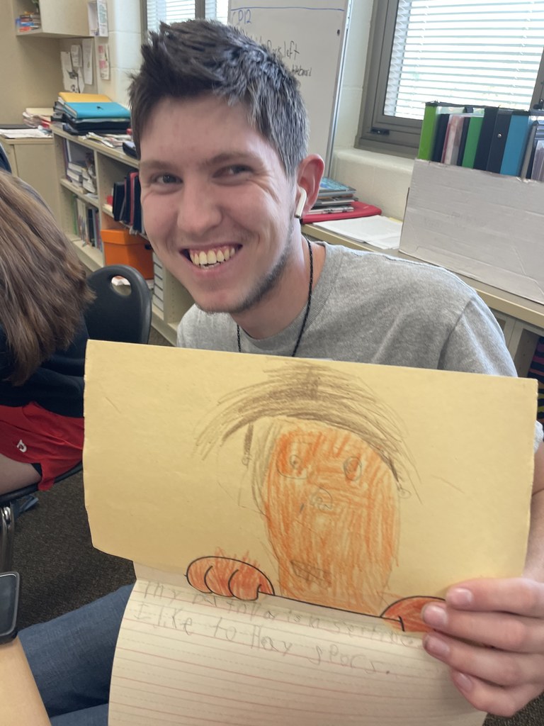A THS senior shows off his work from elementary school.