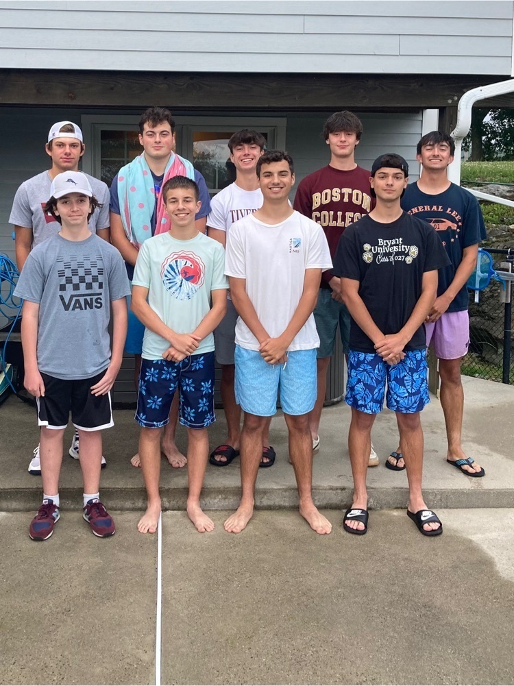 Boys tennis team posing for casual photo