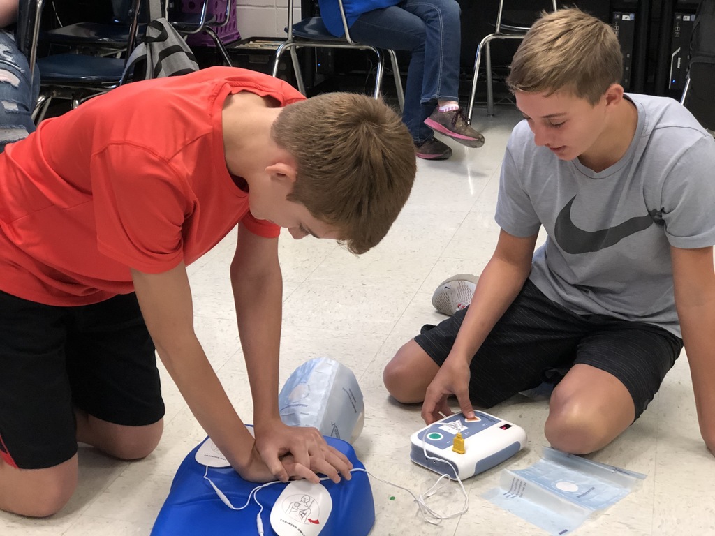 Students doing CPR.