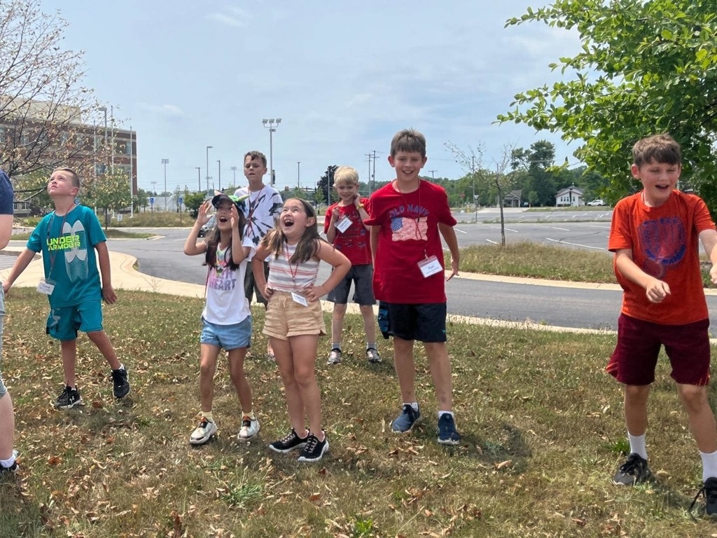 students cheer after their rockets launch