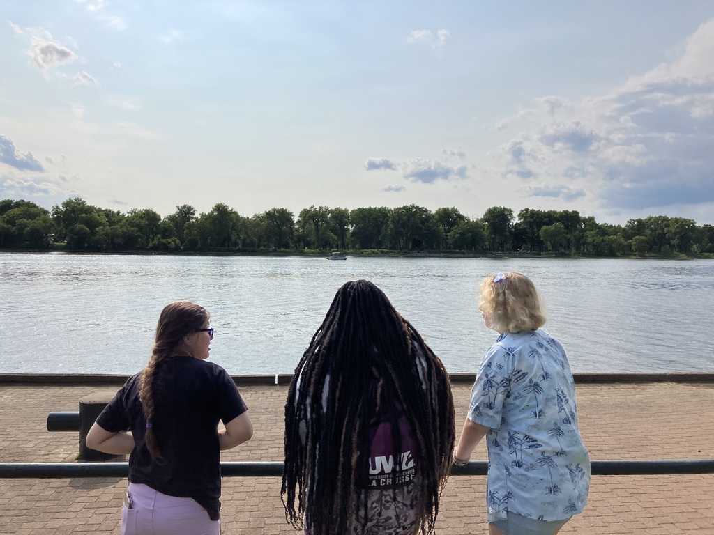 Three students looking out over the water.