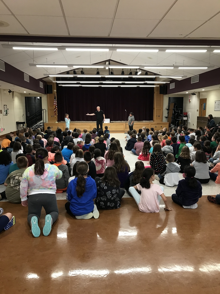 Students participate in a Literacy Alive reading celebration. 