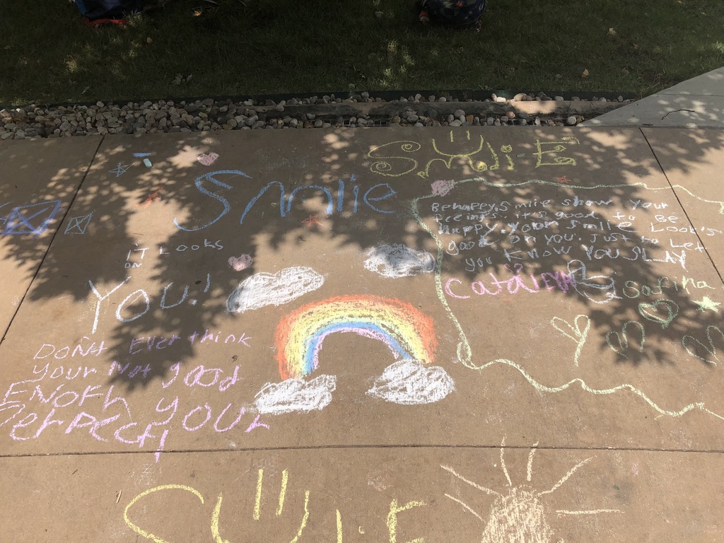 Sidewalk chalk words of inspiration.