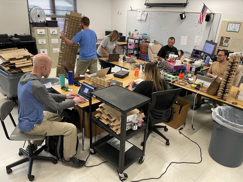 Technology Team preparing student Chromebooks for the start of school