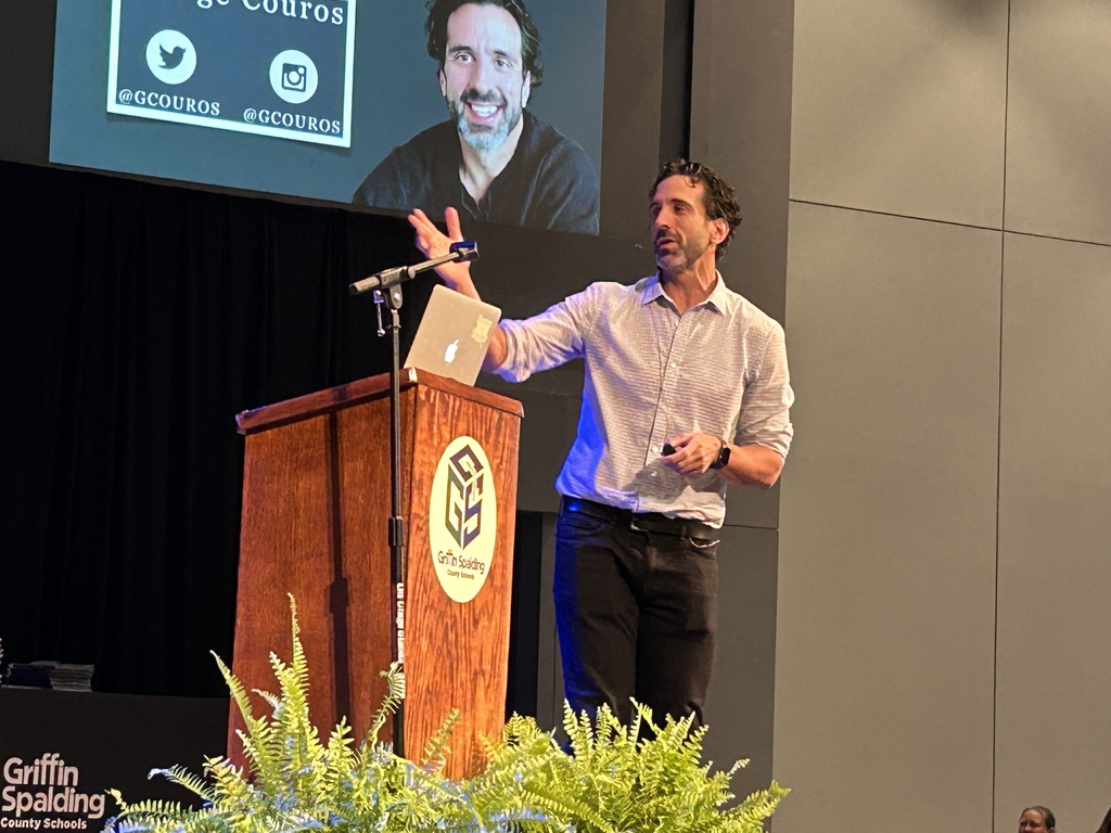 George Couros speaking on stage