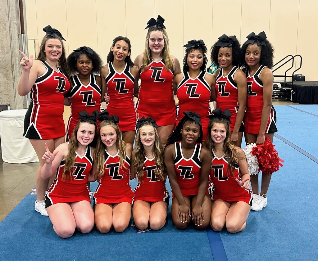 Tyler Legacy Junior Varsity Cheer squad at camp with their awards