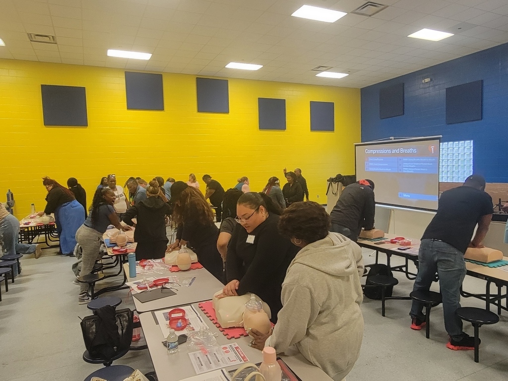 People in Various stages of practicing CPR during CPR Training