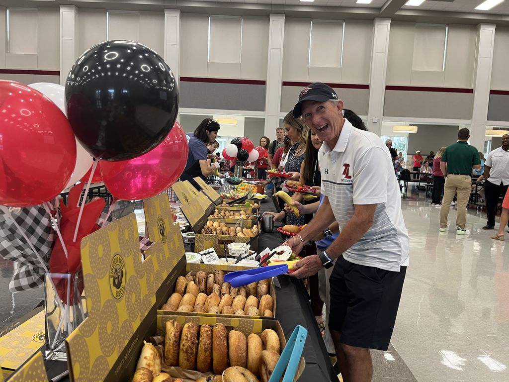 Legacy staff enjoying breakfast provided by Legacy PTA