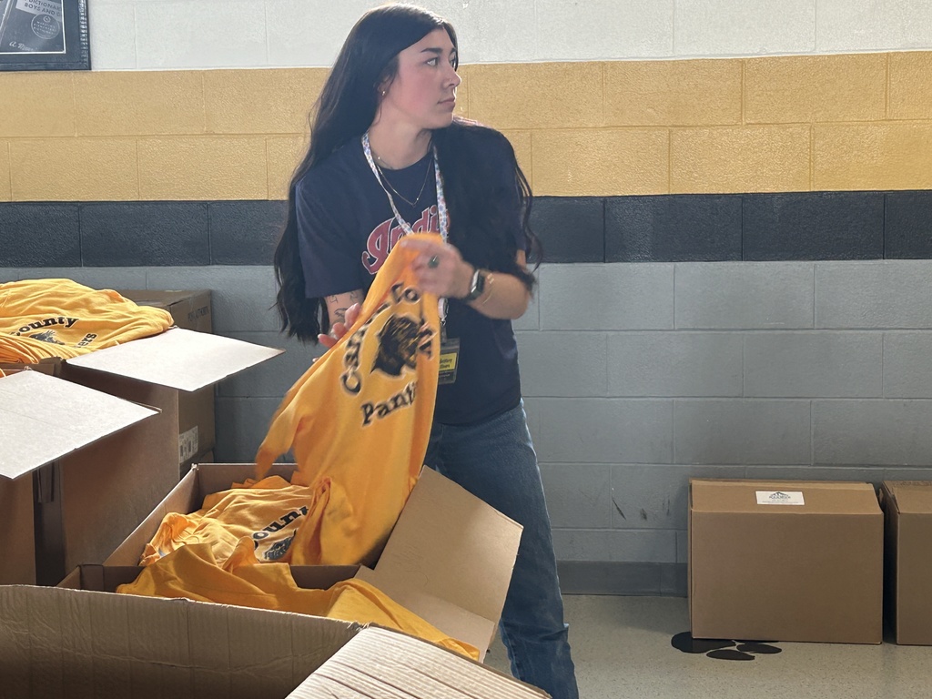 Staff member passing out T-shirts