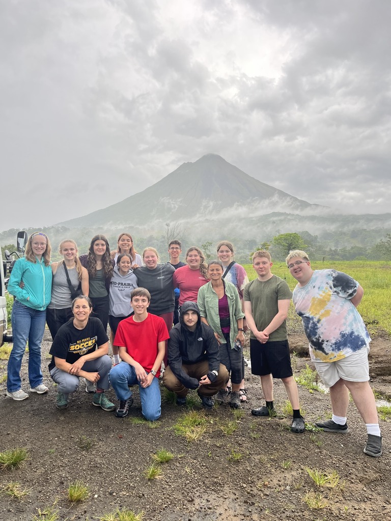 Group photo by a volcano