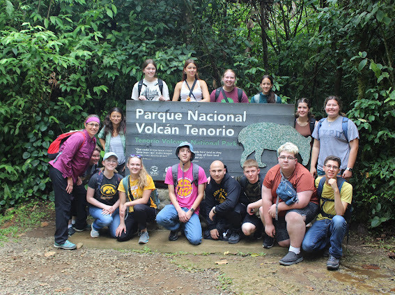 Group photo by the national volcano park sign