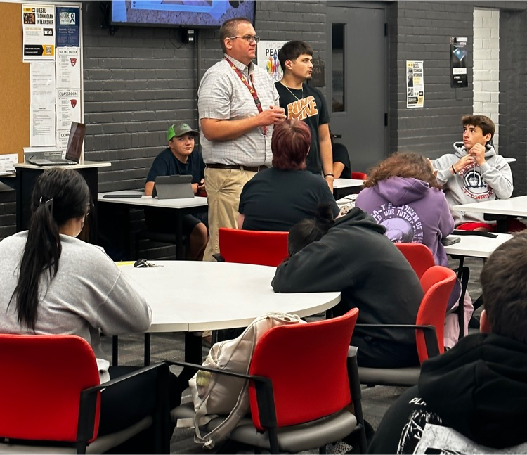 Veteran student helping with leading activity