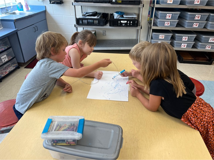 During Exploratories today Kindergarten worked together to try to draw a smile with a marker. The catch? They could only move the marker using the string! Loads of laughs & communication practice! #HESRedHawks