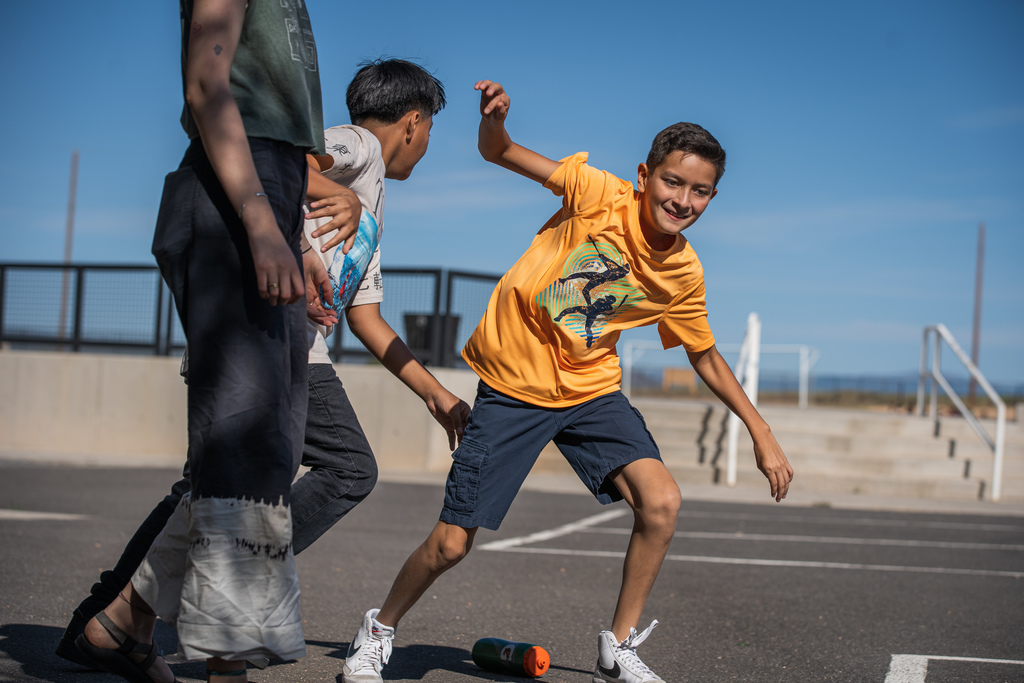 boy trying to avoid being tagged by a classmate