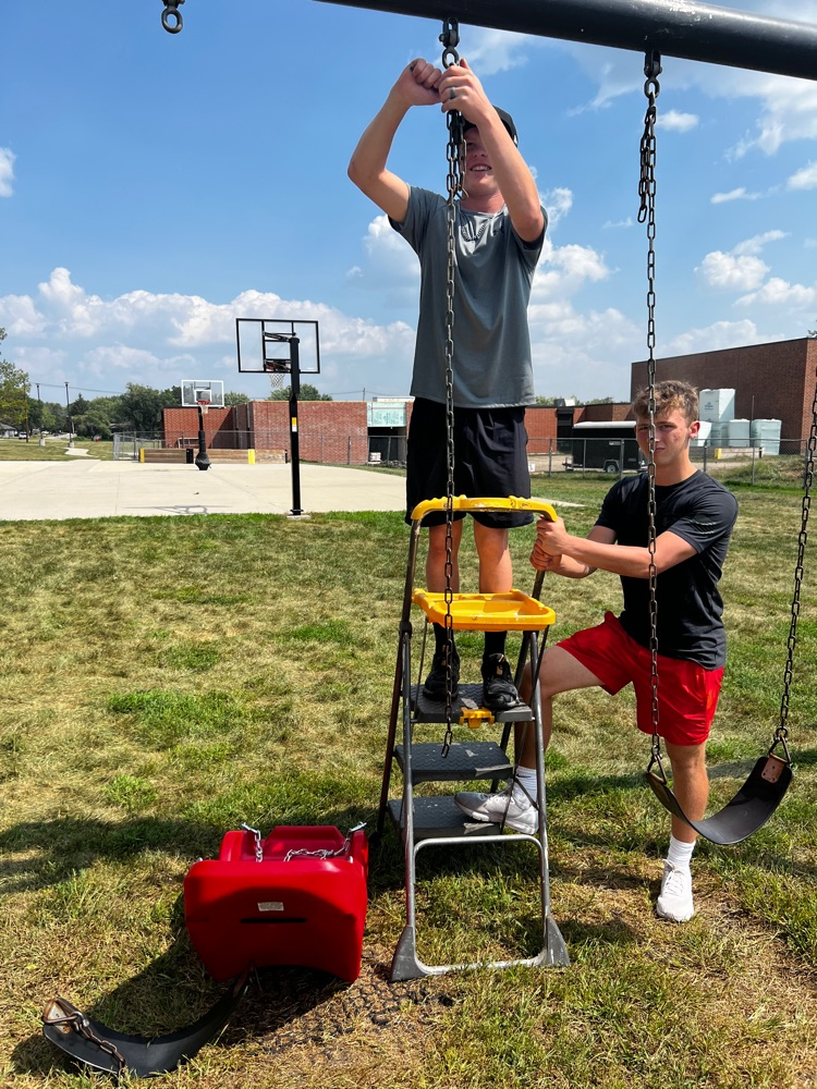 students hanging an ADA swing