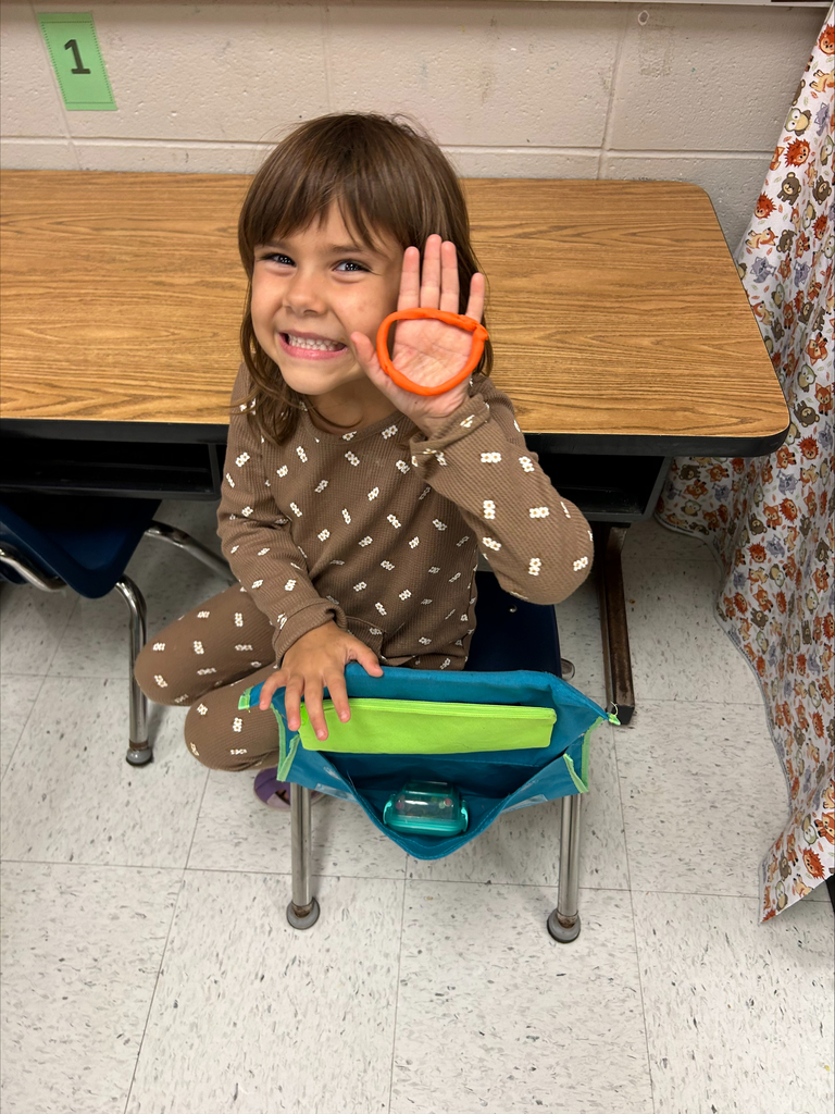 child holding up circle