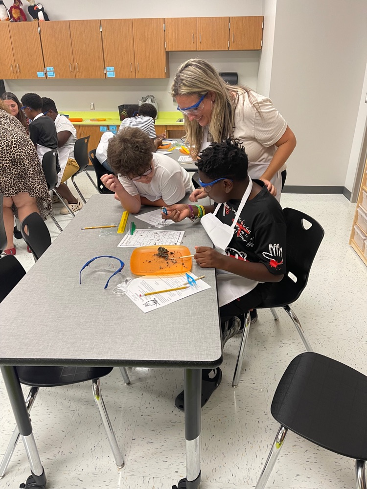 Mrs. Kerlin working with a group of students