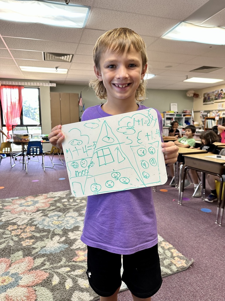 2nd grade student and their math work