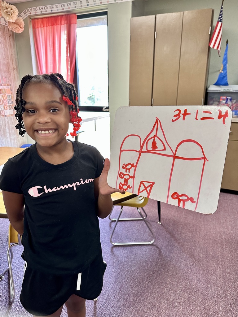 2nd grade student and their math work