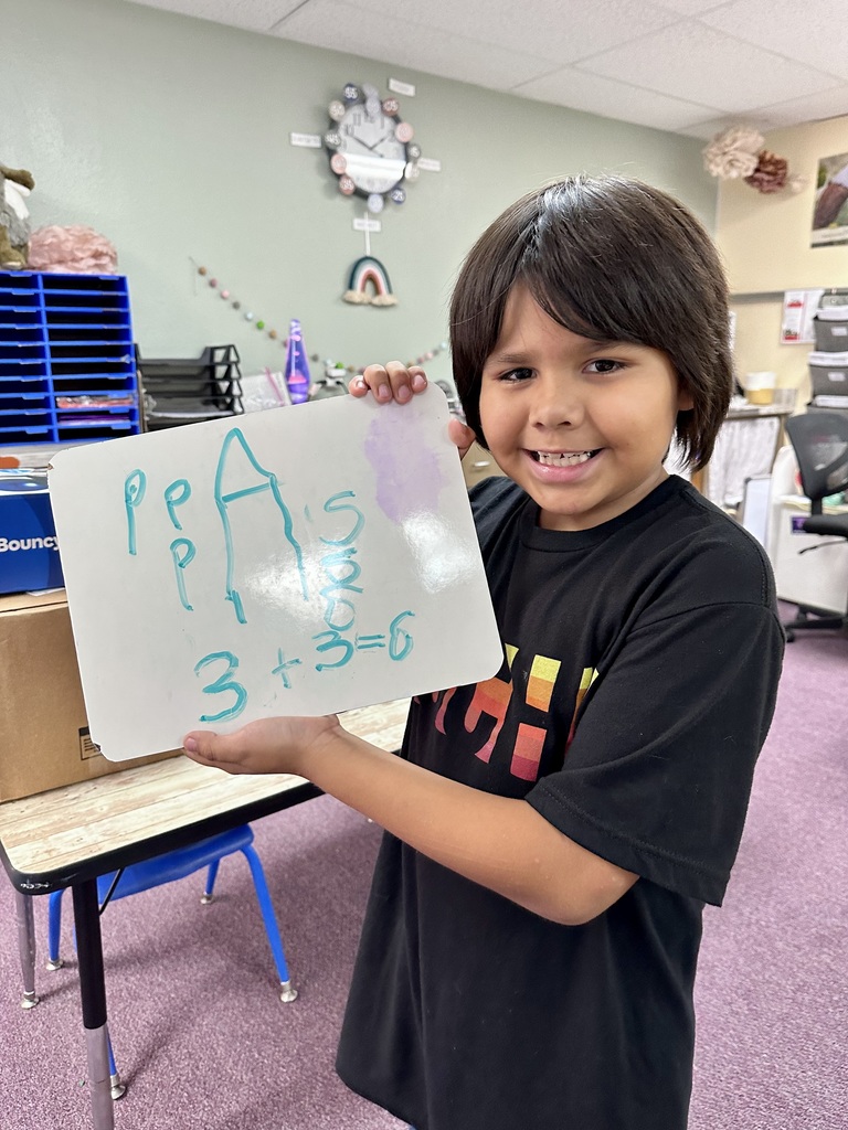 2nd grade student and their math work