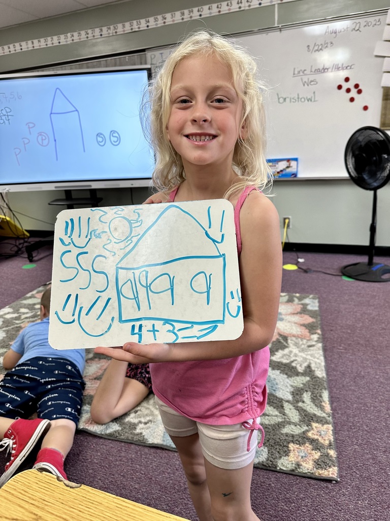 2nd grade student and their math work