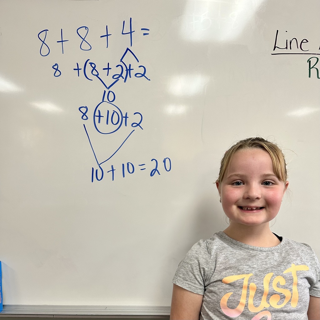 2nd grade student and their math work